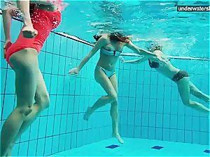 three naked chicks have joy underwater