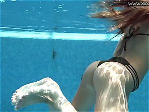 Tiffany Tatum unclothes naked underwater